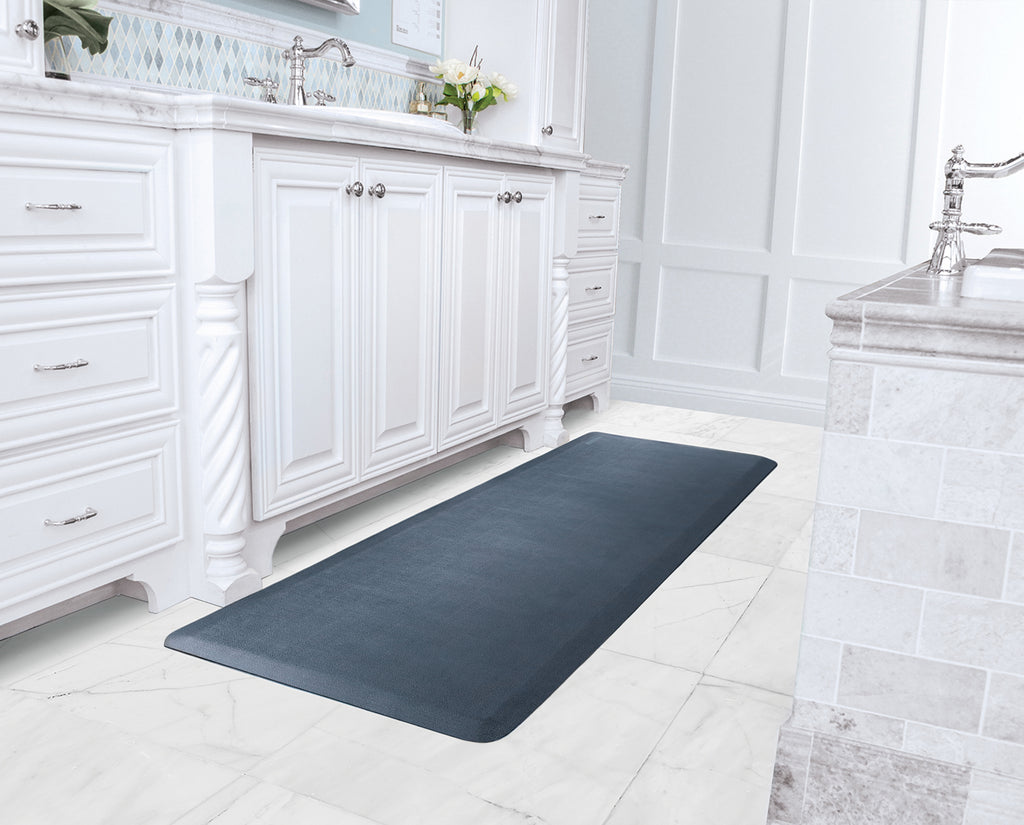 A Lagoon 6'x2' WellnessMat in a bathroom with white marble flooring. 